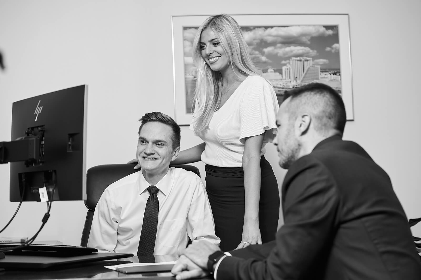 3 McPeak colleagues looking at a shared computer screen